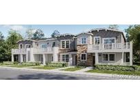 Charming townhomes with stone accents, white trim, and private balconies offer stylish curb appeal at 8959 Whiteclover St, Littleton, CO 80125