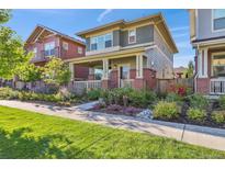 Charming two-story home features a landscaped yard and inviting front porch at 11150 E 26Th Ave, Aurora, CO 80010