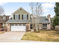 Charming two-story home with a two car garage and a beautifully landscaped front yard at 5951 E Irish Pl, Centennial, CO 80112