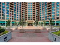 Attractive condominium complex with brick facade and inviting courtyard entrance at 8100 E Union Ave # 1502, Denver, CO 80237