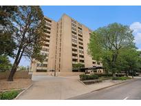 Multi-story building with brick facade, mature trees, and well-maintained landscaping at 800 N Pearl St # 1109, Denver, CO 80203