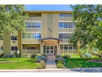 A full shot of 350 S Clinton St showing the beautifully landscaped exterior with brick design and a clean lush lawn at 350 S Clinton St # 9B, Denver, CO 80247