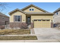 Charming single-Gathering home with a two-car garage, stone accents, and well-maintained front yard at 3325 Yale Dr, Broomfield, CO 80023