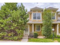 Inviting home featuring an exterior elevation with lush landscaping and a well-manicured lawn at 14129 E Dickinson Dr # D, Aurora, CO 80014