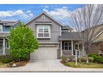 Charming two-story home with a covered front porch, attached garage, and well-maintained landscaping at 1867 W 137Th Ln, Broomfield, CO 80023