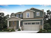 Charming two-story home featuring a two-car garage, stone accents, and a welcoming front porch at 719 N Deer Park, Watkins, CO 80137