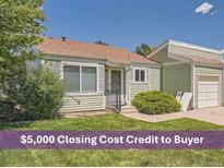 Charming single-Gathering home with well-maintained lawn, mature trees, and a welcoming entrance at 16149 E Rice Pl # A, Aurora, CO 80015
