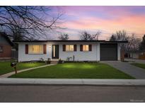 Charming single-story home featuring a well-manicured lawn and an attached one-car garage at 6511 S Cedar St, Littleton, CO 80120