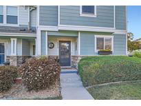 Inviting front door with stone accents and a decorative wreath at 5843 Ceylon St, Denver, CO 80249