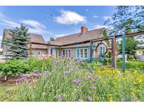 Charming home featuring a colorful wildflower garden in the front yard at 1019 24Th St, Golden, CO 80401