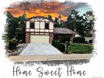 Charming exterior featuring a two-story home with a well-maintained lawn and inviting curb appeal at 5138 S Sedalia Ct, Centennial, CO 80015
