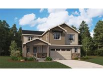 Charming two-story home with stone accents, a covered porch and an attached two-car garage at 24970 E 42Nd Ave, Aurora, CO 80019