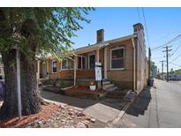 Charming brick duplex with covered porch and 'Coming Soon' signage, nestled near mature trees at 422 E 6Th Ave, Denver, CO 80203