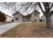 Nice curb appeal! This charming house features a well-maintained lawn and a welcoming front porch at 4632 S Pagosa Cir, Aurora, CO 80015