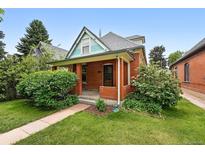 Charming brick home with a welcoming front porch and manicured lawn at 3330 W 30Th Ave, Denver, CO 80211