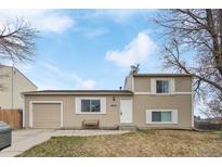 Charming two-story home with neutral-colored exterior, attached garage, and inviting front entrance at 10405 W 107Th Pl, Broomfield, CO 80021