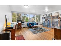 Bright living room with hardwood floors, large windows, and ample natural light at 4430 W 35Th Ave # 6, Denver, CO 80212