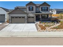 Charming two-story home featuring a welcoming porch and a well-maintained landscaped front yard at 1280 Gentle Rain Dr, Castle Rock, CO 80109