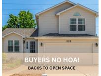 Charming two-story home with a well-manicured lawn and inviting curb appeal at 606 Beth Ave, Fort Lupton, CO 80621