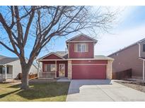 Charming two-story home with a well-manicured lawn and an attached two-car garage at 5300 E 129Th Way, Thornton, CO 80241