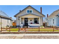 Charming single-story home with a well-maintained lawn and inviting front porch at 1308 S Sherman St, Denver, CO 80210