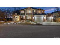 Beautiful two-story home featuring a three-car garage, bay window, and well-maintained lawn in a desirable neighborhood at 10103 Meadowbriar Ln, Highlands Ranch, CO 80126