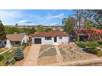 Charming home with a one-car garage, professional landscaping, and a cozy, inviting curb appeal at 716 S Osage, Denver, CO 80223