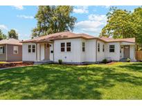 Charming single-story home with white siding and a well-maintained lawn at 4465 N Umatilla St, Denver, CO 80211