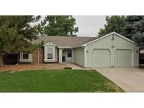 Charming single-story home with a two-car garage and well-maintained front yard at 19383 E Chaffee Pl, Denver, CO 80249