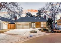 Charming single-story home featuring a landscaped front yard and two-car attached garage at 2867 S Oswego Ct, Aurora, CO 80014
