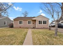 Charming single-story home featuring a well-maintained lawn and inviting walkway at 3316 W 73Rd Ave, Westminster, CO 80030