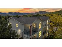Stunning townhome with a mountain view featuring balconies and a well-maintained exterior at 1670 S Deframe St # C2, Lakewood, CO 80228