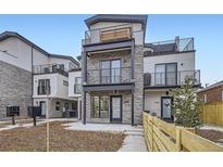 Modern townhouse with multi-level balconies and stone facade at 1462 Yates St, Denver, CO 80204