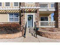 Welcoming front door with wreath and decorative stone accents, leading to a charming residence at 9307 Amison Cir # 202, Parker, CO 80134