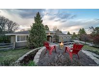 Beautiful front yard with fire pit and inviting seating, great for outdoor relaxation and enjoyment at 5631 Silver Bluff Ct, Parker, CO 80134