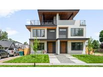 Modern townhome showcases a roof deck, stylish facade, and well-manicured lawn at 2926 S Cherokee St, Englewood, CO 80110