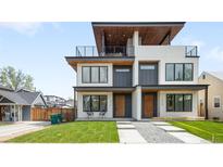 Stunning modern exterior with a second-story balcony and manicured front lawn at 2926 S Cherokee St, Englewood, CO 80110