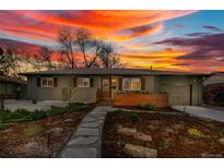 Charming home with landscaped front yard and stone walkway, set against a vibrant sunset sky at 4655 Ludlow St, Boulder, CO 80305