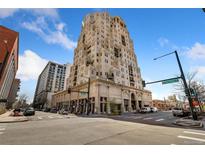 Modern high-rise condominium building in an urban neighborhood setting with retail storefronts below at 300 W 11Th Ave # 10D, Denver, CO 80204