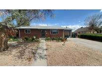 Charming brick home with a well-maintained lawn and landscape at 7620 Hooker St, Westminster, CO 80030
