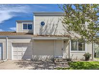 Charming two-story home featuring a well-maintained front yard and a cozy, inviting entrance at 15976 E Radcliff Pl # A, Aurora, CO 80015