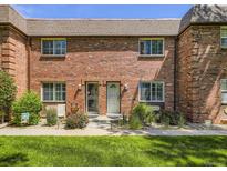 Charming brick facade with well-manicured lawn, inviting entrance, and cozy curb appeal on a sunny day at 5525 S Lowell Blvd, Littleton, CO 80123