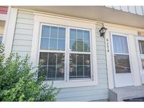 Charming townhome with updated windows, complemented by lush greenery for a welcoming curb appeal at 6774 S Independence St, Littleton, CO 80128