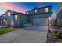 Charming two-story home featuring a two-car garage and a well-maintained front yard at 4644 S Kipling Cir, Littleton, CO 80123