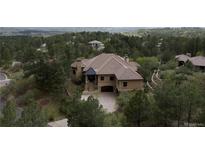 Stunning luxury home with a tile roof, landscaped grounds and a two-car garage at 214 Equinox Dr, Castle Rock, CO 80108