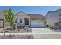 Charming single-Gathering home with stone accents, a two-car garage, and a well-maintained front yard at 15286 Fillmore St, Thornton, CO 80602