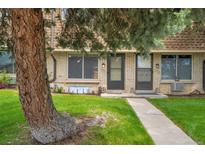 Charming townhome exterior with well-maintained lawn and inviting walkway at 12931 W 20Th Ave, Golden, CO 80401