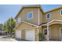 Inviting two-story condo featuring a private garage and a charming entrance at 3200 S Federal Blvd # 5, Denver, CO 80236
