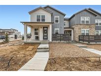 Charming two-story home features a welcoming porch, neutral color palette, and modern design at 2653 W 69Th Dr, Denver, CO 80221