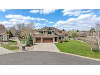 Beautiful two-story home with a three-car garage and well-maintained front yard at 14461 Inca Ct, Westminster, CO 80023